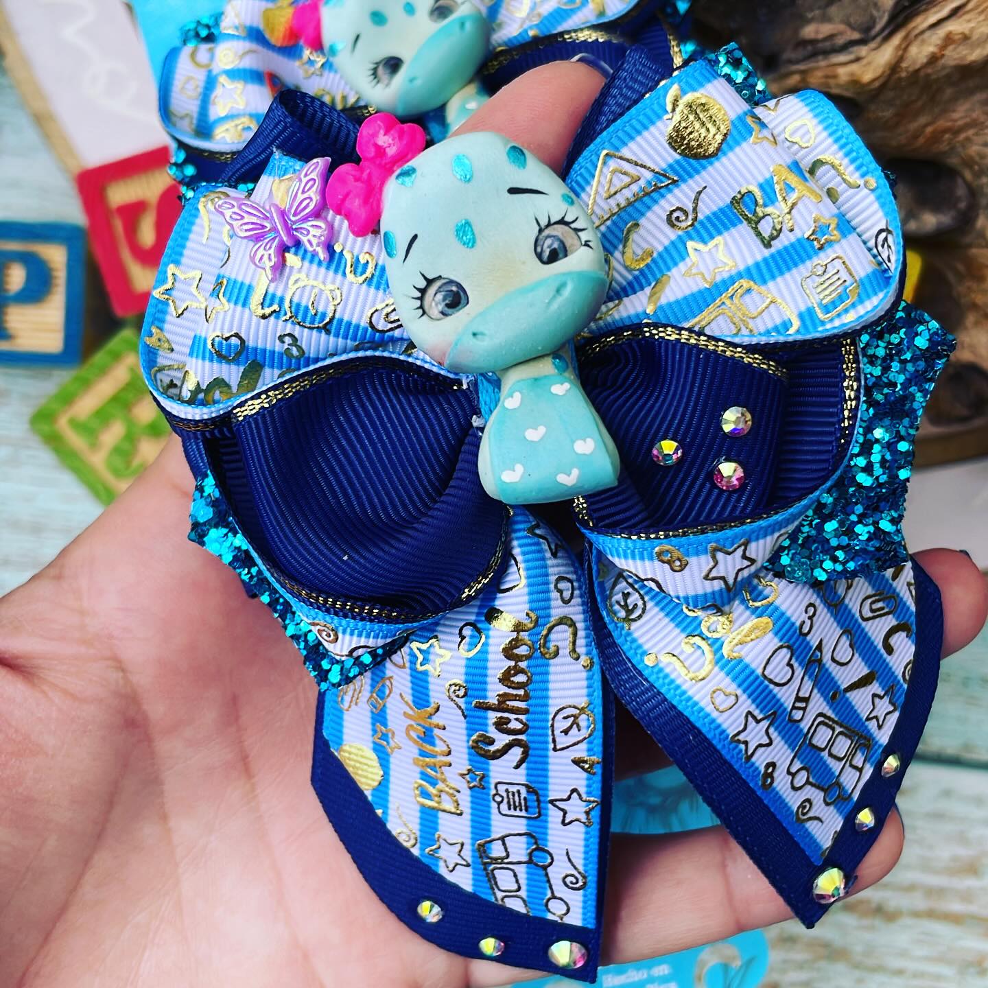 Par de prensitas con lazos temática Escolares | Dinosaurios