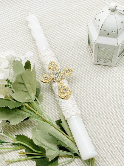 Candela torneada con cruz dorada en pedrería