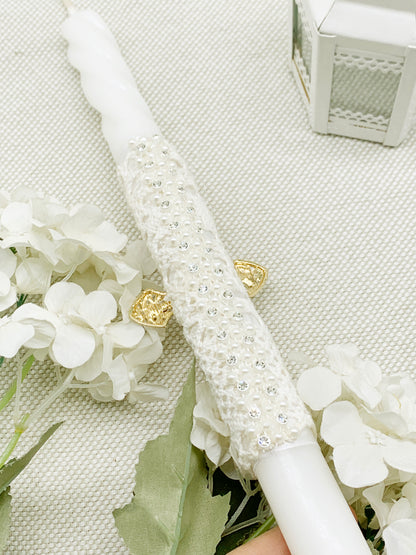 Candela torneada con cruz dorada en pedrería