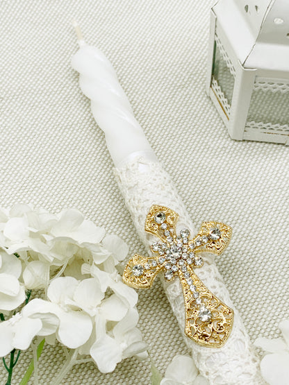 Candela torneada con cruz dorada en pedrería