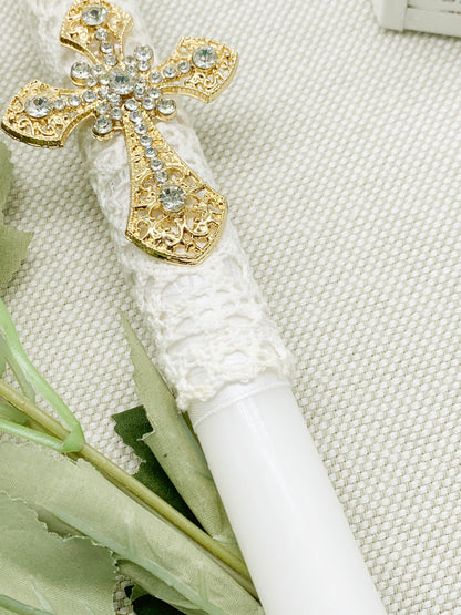 Candela torneada con cruz dorada en pedrería