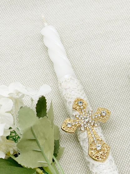 Candela torneada con cruz dorada en pedrería