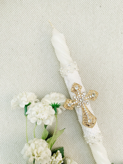 Candela torneada con cruz dorada en pedrería