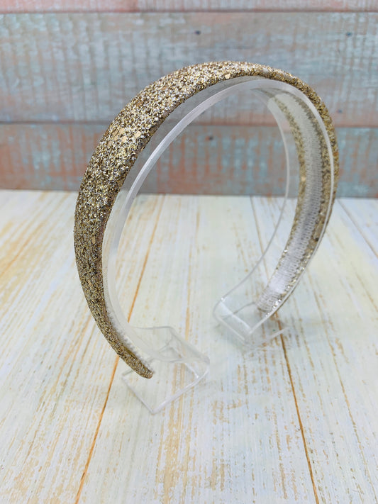 Diadema con glitter dorado