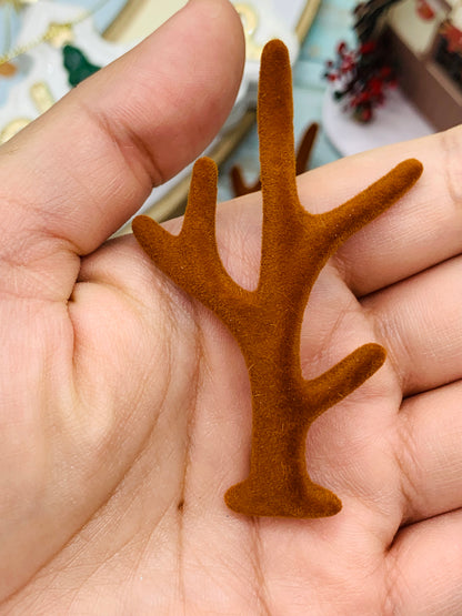 Par de cuernitos con cubrimiento similar a gamuza 8 cm aprox