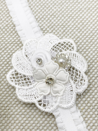 Vincha con detalles de rosa y pedrería