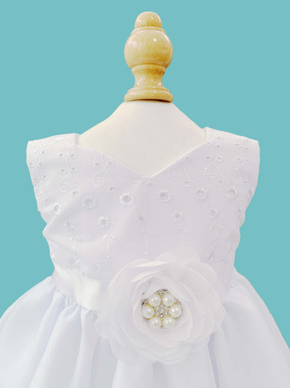 Vestido desmangado con flor